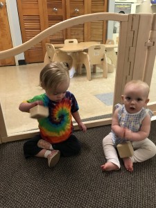 Juno and friend play with musical blocks.