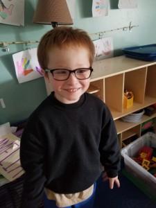 Aiden now - looking handsome in his new glasses!